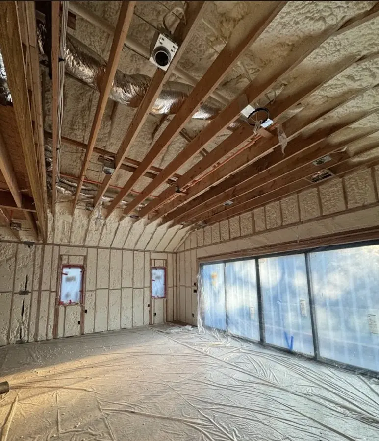 Interior walls and ceiling insulated with spray foam during new construction in Bakersfield